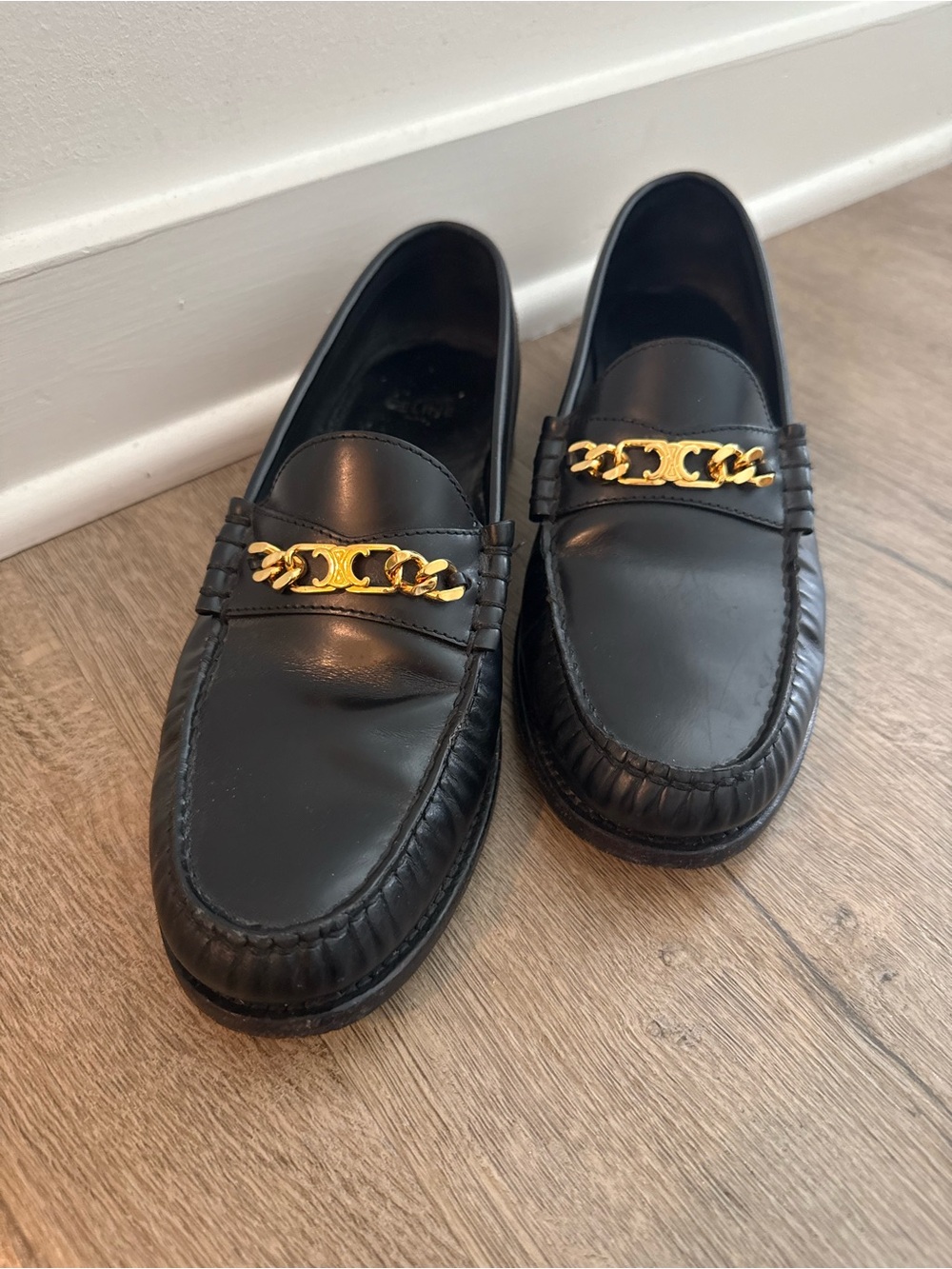 Black Leather Celine Loafers with Gold Chain Accent